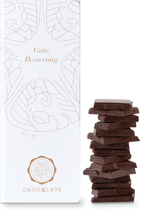 CHOCQLATE „Gute Besserung“ Schokolade 50 % mit Haselnussmus – Verpackung, Schokoladenstücke und Haselnüssen